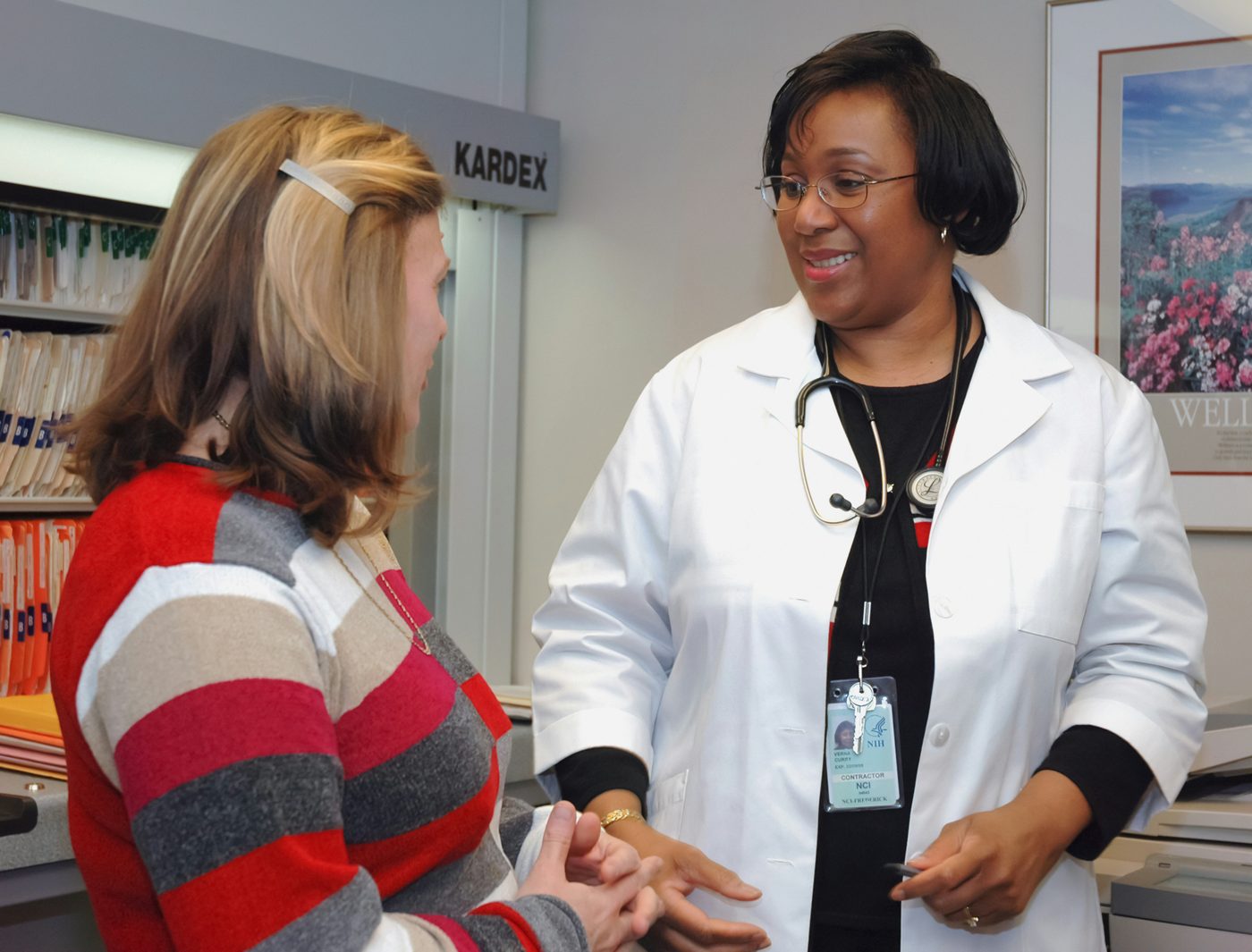 Primary care provider warmly consulting with a patient