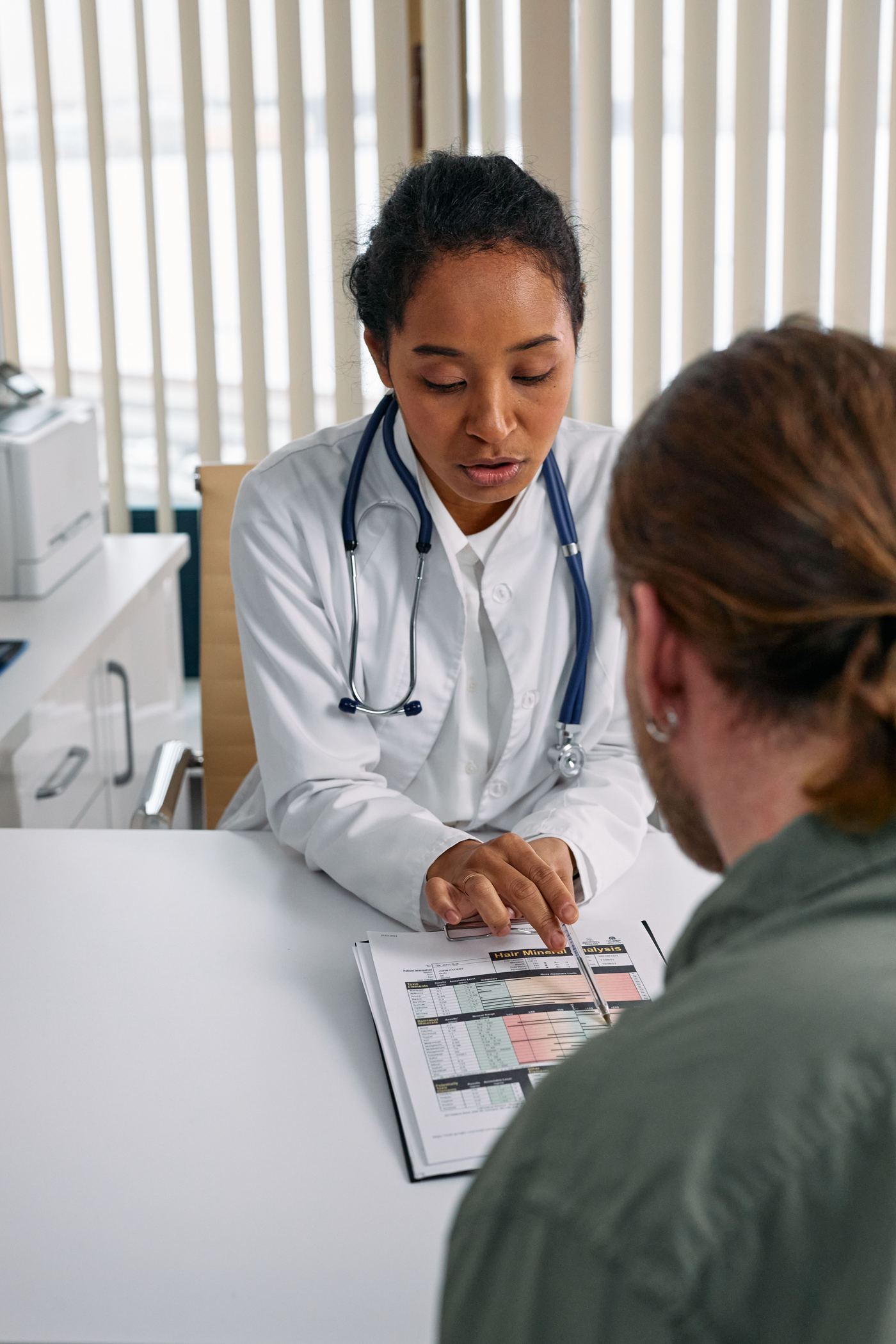Primary care provider in a warm consultation with a patient